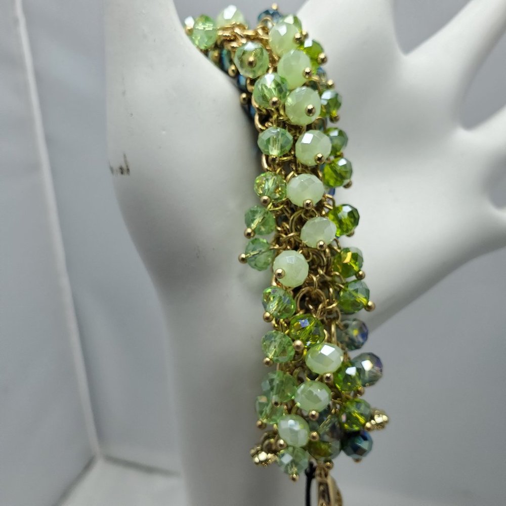 Ali Khan beaded bracelet with gold links. color aqua-green-seagrass beads